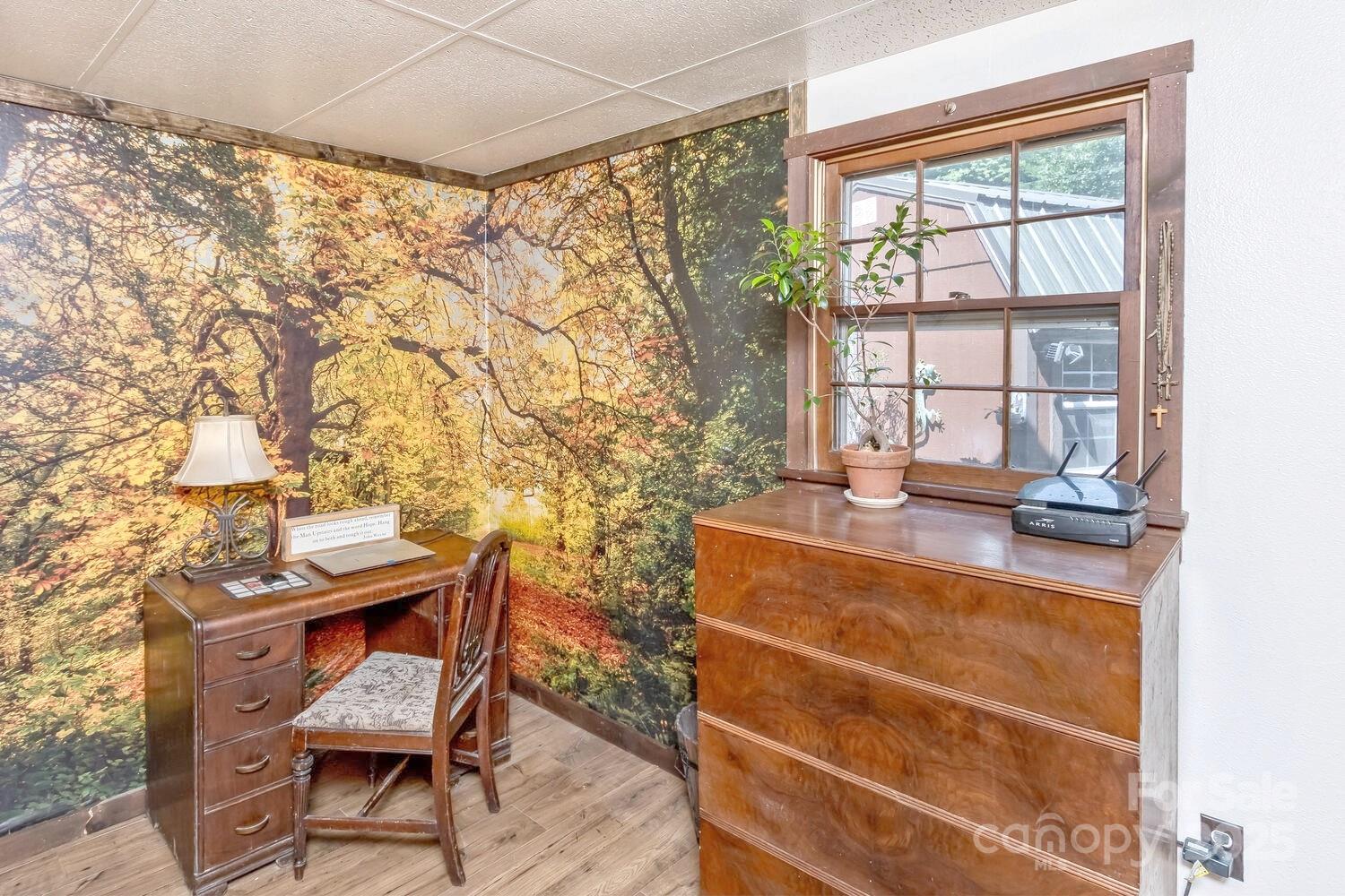 557 Tumbling Fork Road Waynesville, NC 28785 - Photo 15 of 44 a room with a table and a chair