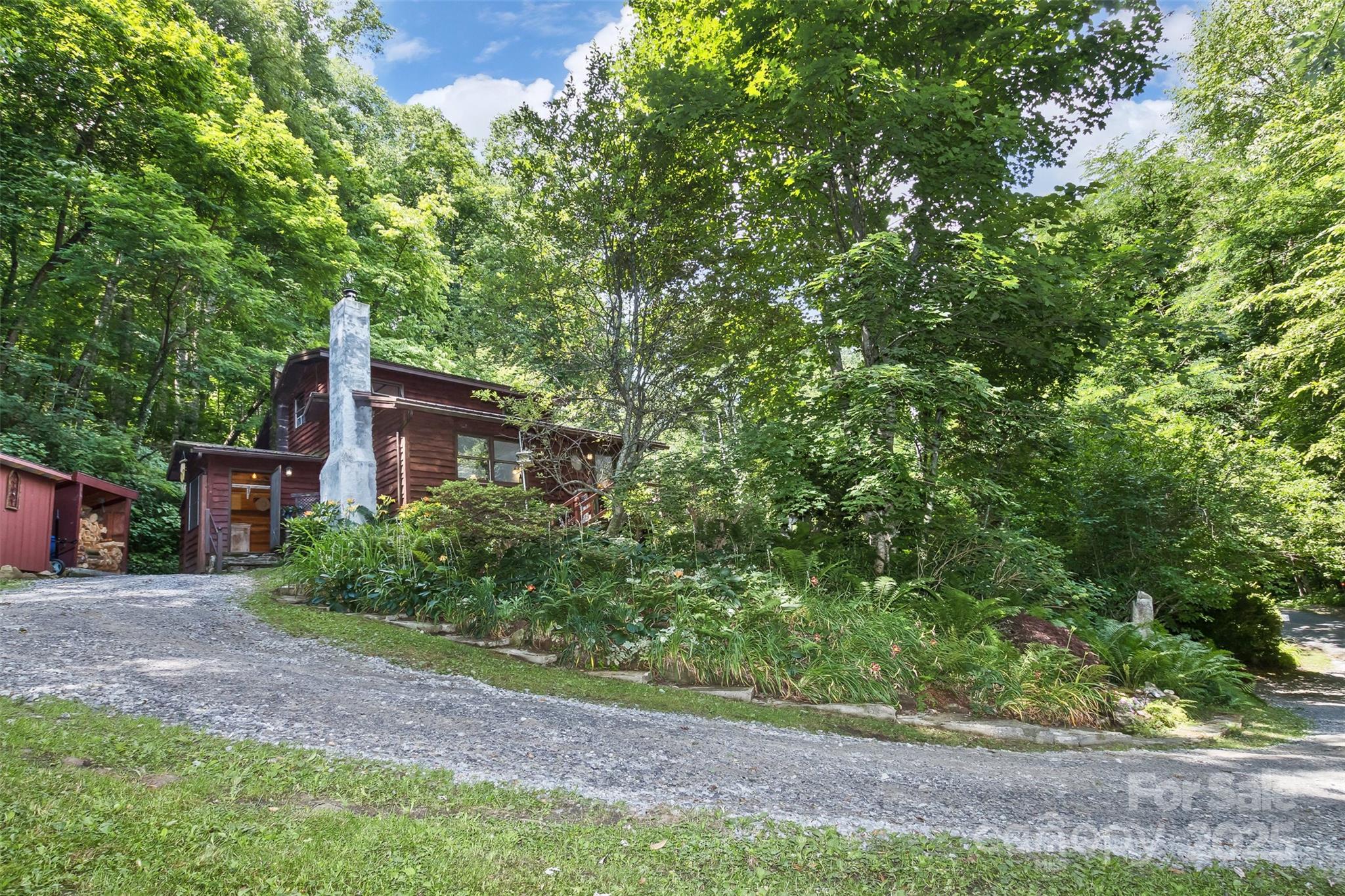 557 Tumbling Fork Road Waynesville, NC 28785 - Photo 44 of 44 a view of a house with a tree