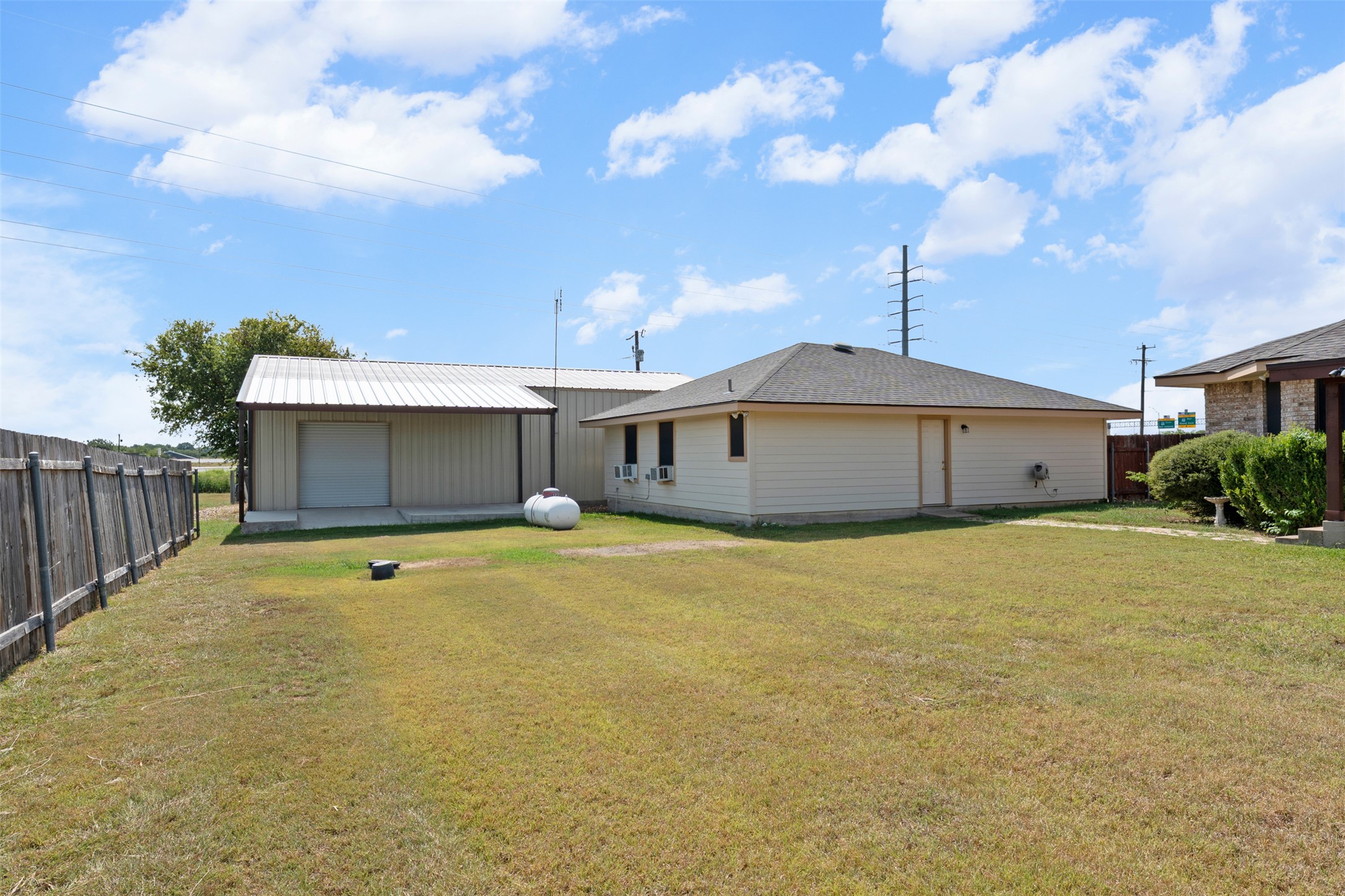 1512 Panther Loop Pflugerville, TX 78660 - Photo 32 of 40 A spacious backyard with an additional detached structure offers versatile outdoor living.