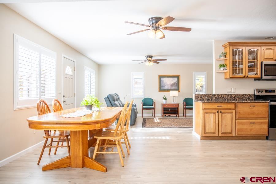 490 6403 Road Montrose, CO 81403 - Photo 13 of 40 a view of a dining room with furniture window and outside view