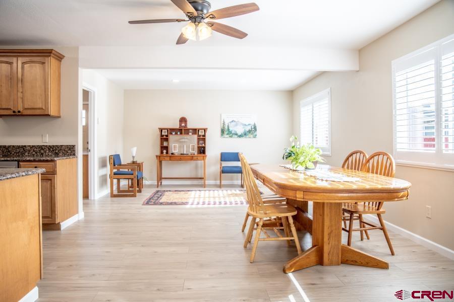 490 6403 Road Montrose, CO 81403 - Photo 15 of 40 a view of a dining room with furniture and wooden floor
