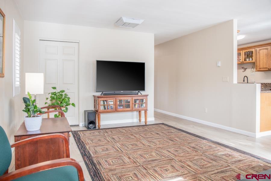 490 6403 Road Montrose, CO 81403 - Photo 17 of 40 a living room with furniture and a flat screen tv