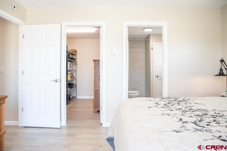 490 6403 Road Montrose, CO 81403 - Photo 18 of 40 a view of a bedroom with wooden floor