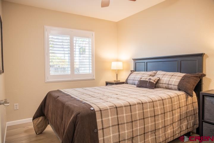 490 6403 Road Montrose, CO 81403 - Photo 28 of 40 a bedroom with a bed and a window
