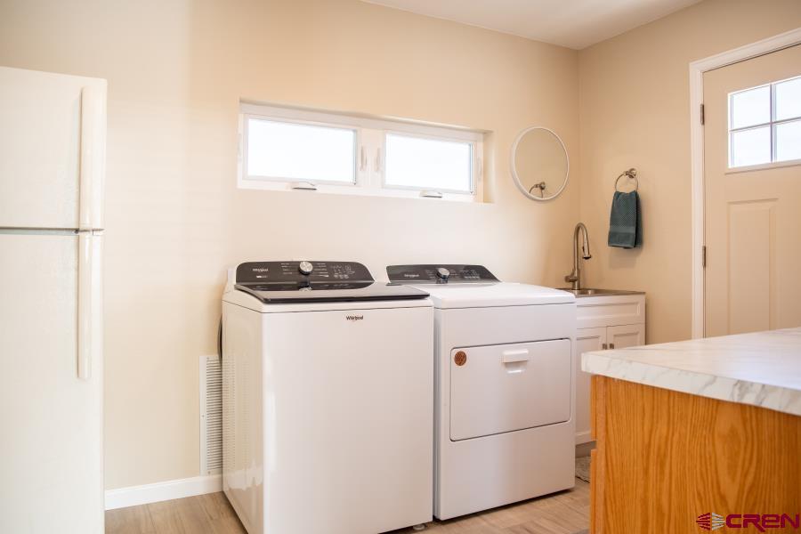 490 6403 Road Montrose, CO 81403 - Photo 29 of 40 a utility room with dryer and washer