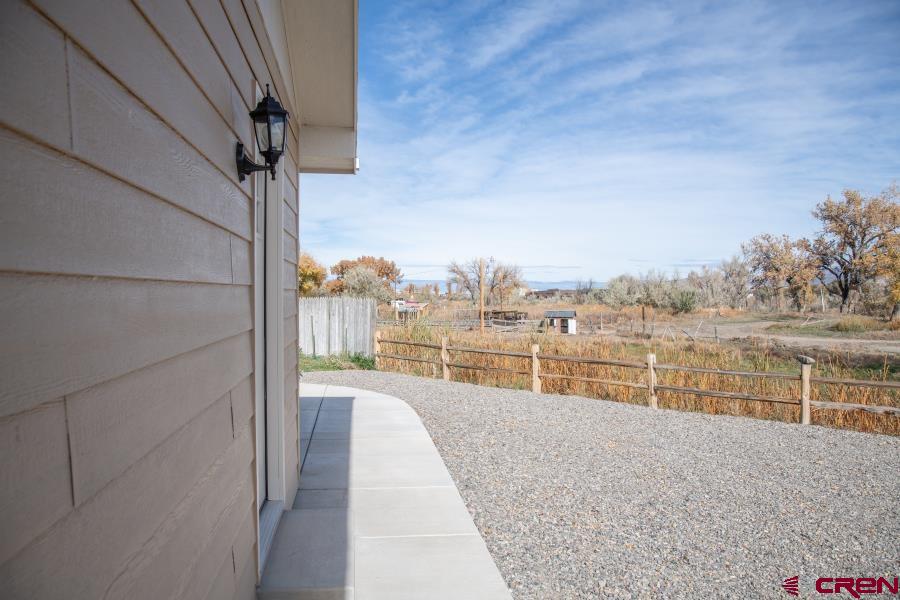 490 6403 Road Montrose, CO 81403 - Photo 32 of 40 a view of a lake from a balcony