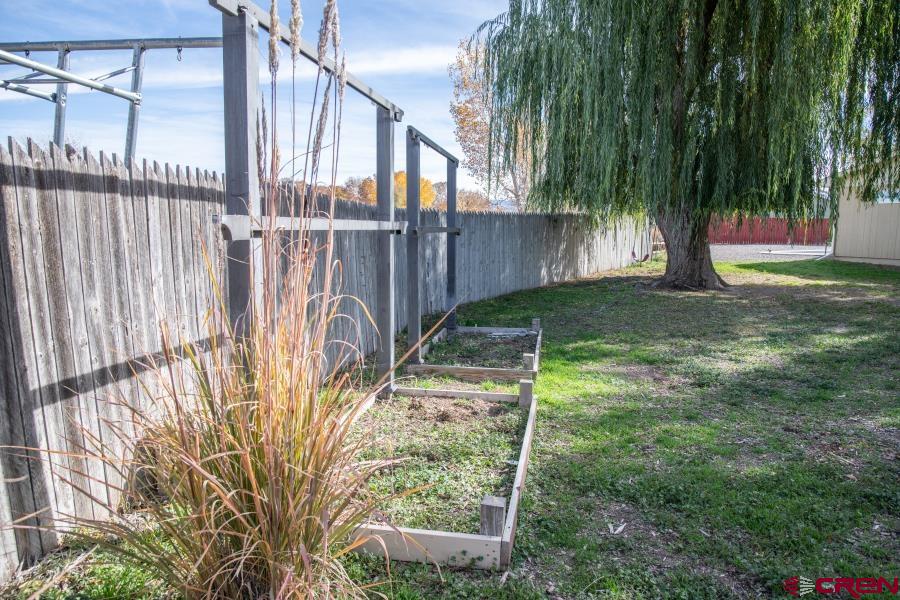 490 6403 Road Montrose, CO 81403 - Photo 36 of 40 a view of a backyard with pathway