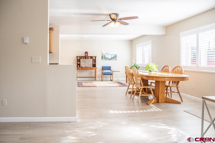 490 6403 Road Montrose, CO 81403 - Photo 6 of 40 a view of a dining room with furniture and a window