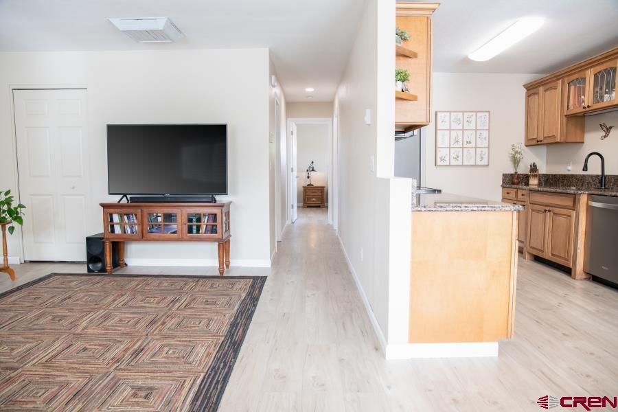 490 6403 Road Montrose, CO 81403 - Photo 7 of 40 a view of a living room with furniture and a flat screen tv