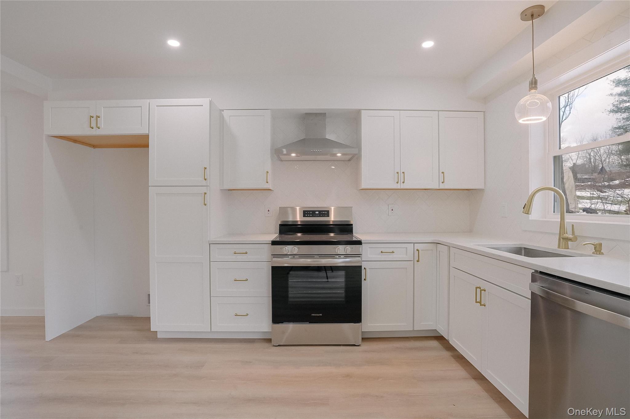 17 Maple Street Beacon, NY 12508 - Photo 13 of 39 a kitchen with stainless steel appliances granite countertop a stove and white cabinets