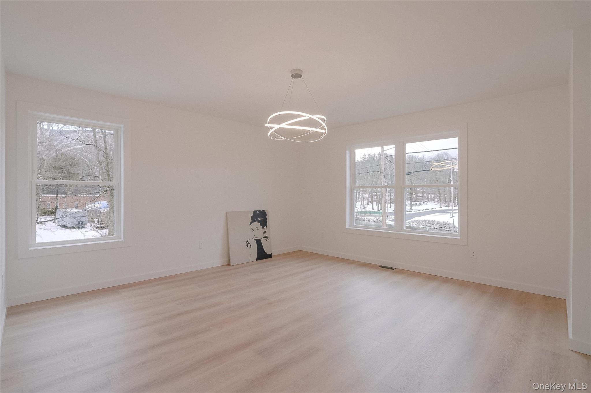 17 Maple Street Beacon, NY 12508 - Photo 19 of 38 Unfurnished dining area featuring plenty of natural light, light wood-type flooring, and a chandelier