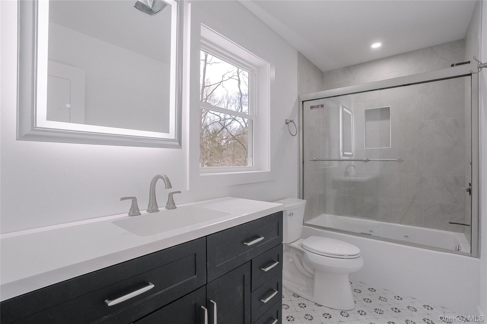 17 Maple Street Beacon, NY 12508 - Photo 24 of 38 Full bathroom with shower / bath combination with glass door and vanity
