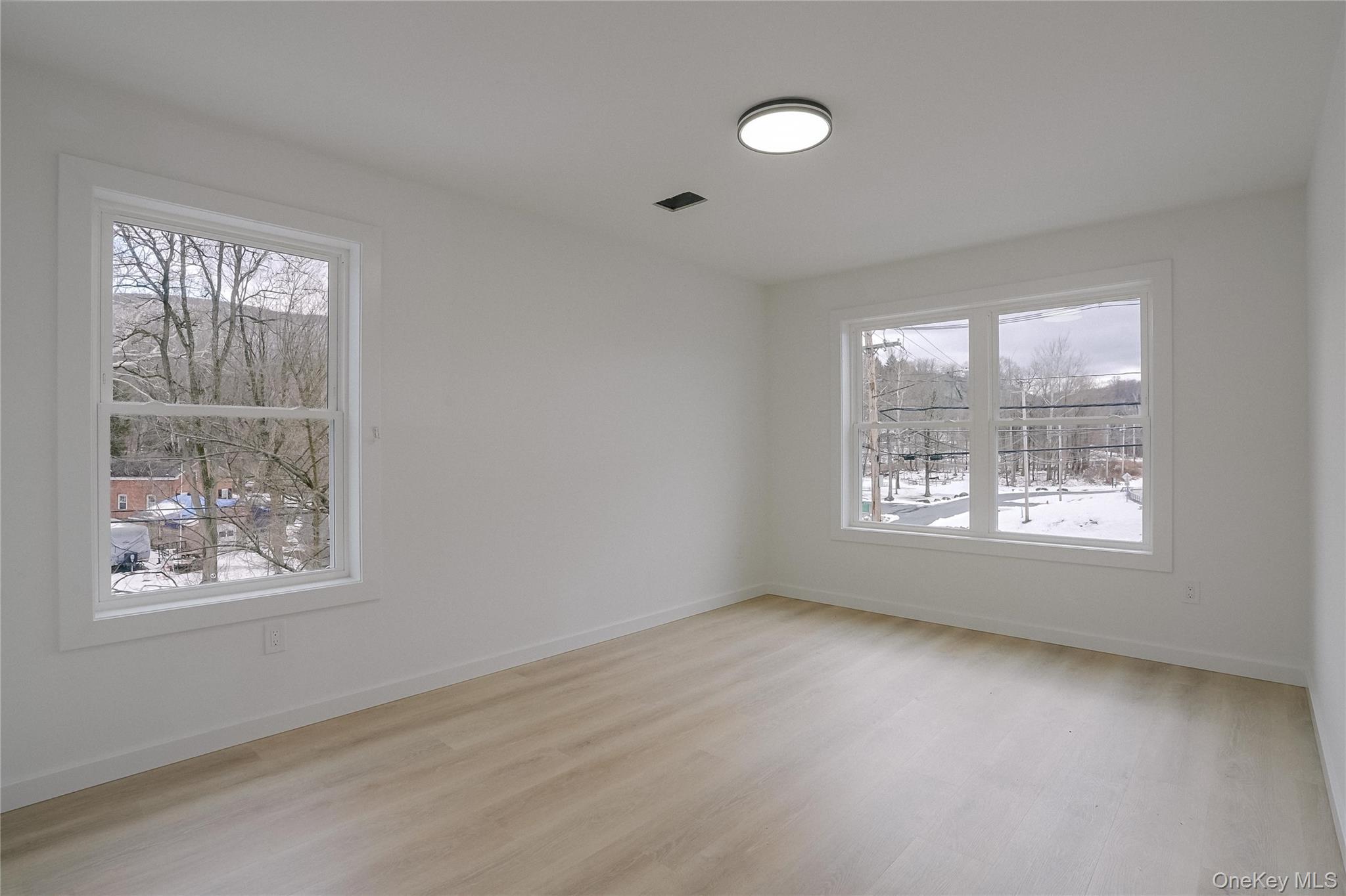 17 Maple Street Beacon, NY 12508 - Photo 25 of 38 Empty room with light wood finished floors and baseboards