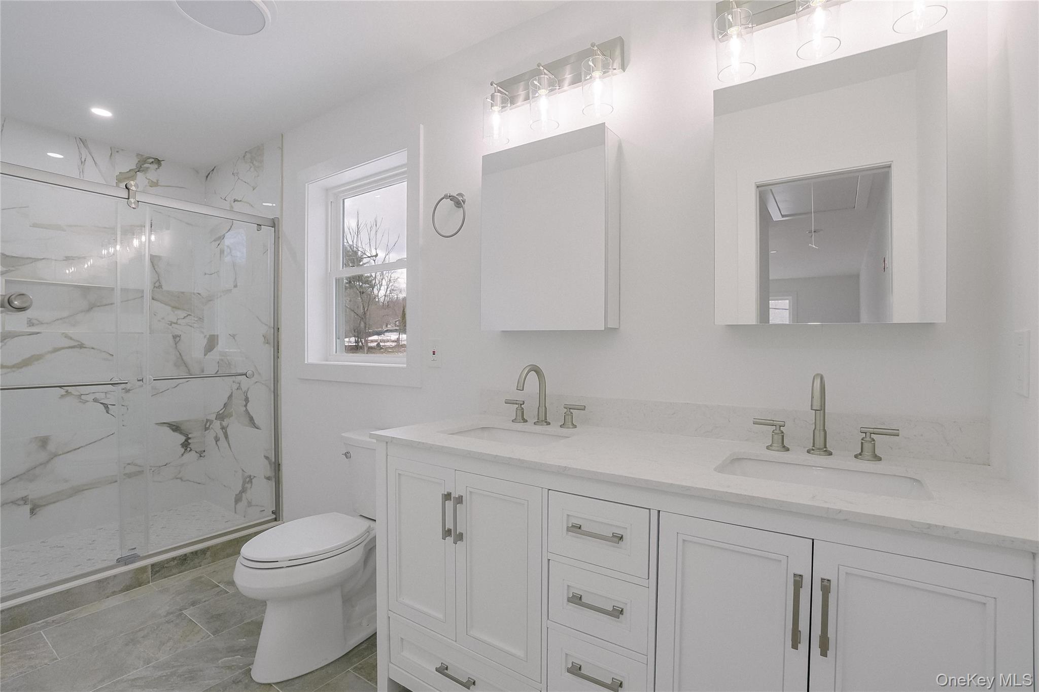 17 Maple Street Beacon, NY 12508 - Photo 30 of 39 a bathroom with a toilet a sink a mirror a shower a vanity and window