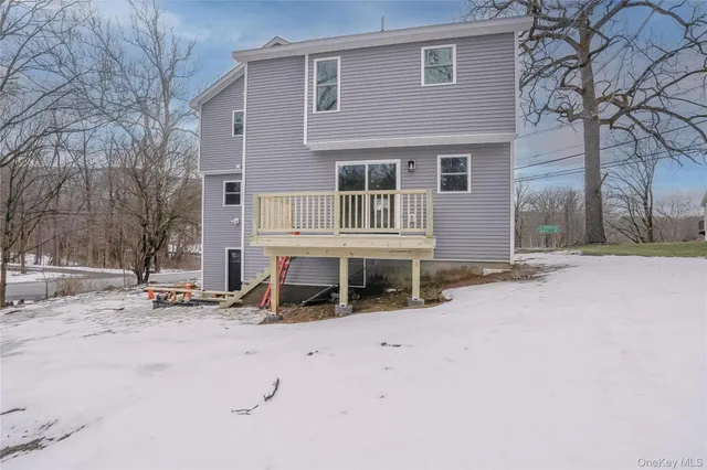 a view of a backyard of the house