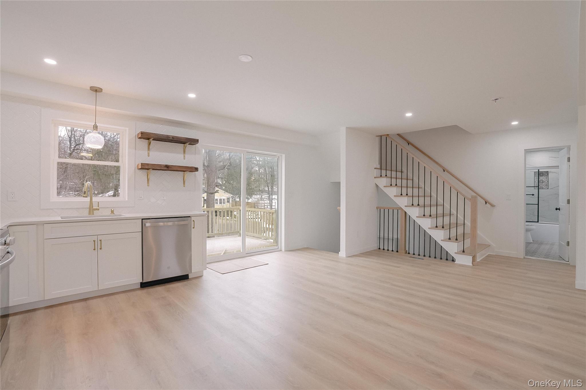 17 Maple Street Beacon, NY 12508 - Photo 5 of 39 a view of a big room with wooden floor windows and cabinet