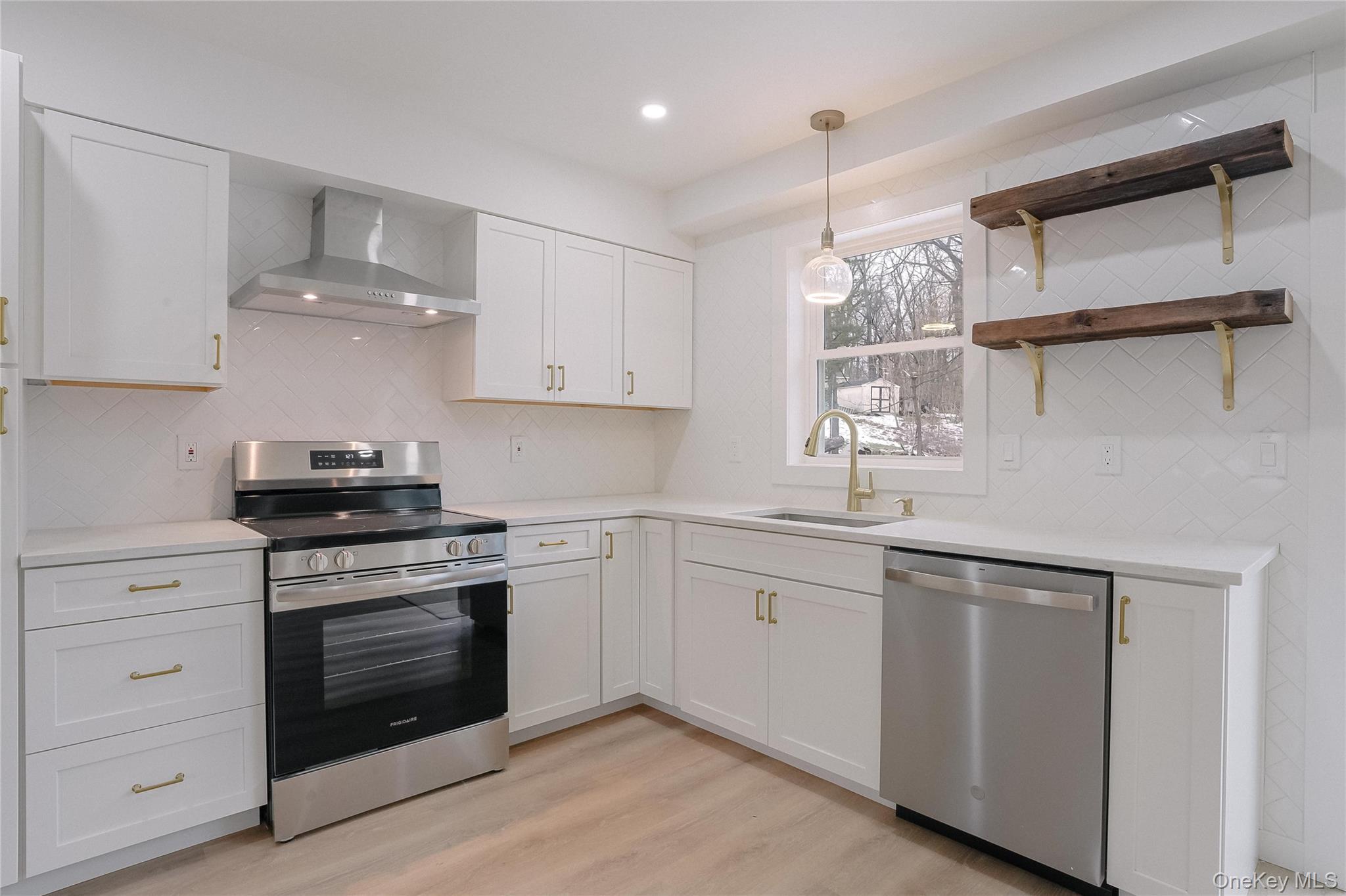 17 Maple Street Beacon, NY 12508 - Photo 5 of 35 a kitchen with cabinets appliances and a window