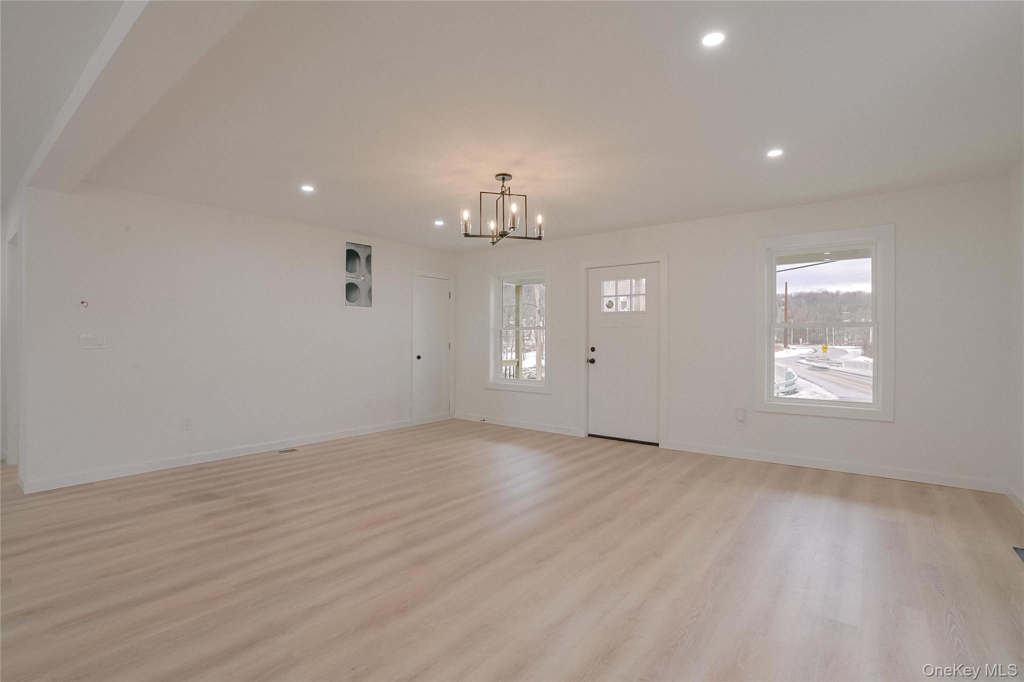 17 Maple Street Beacon, NY 12508 - Photo 10 of 35 an empty room with chandelier fan and windows