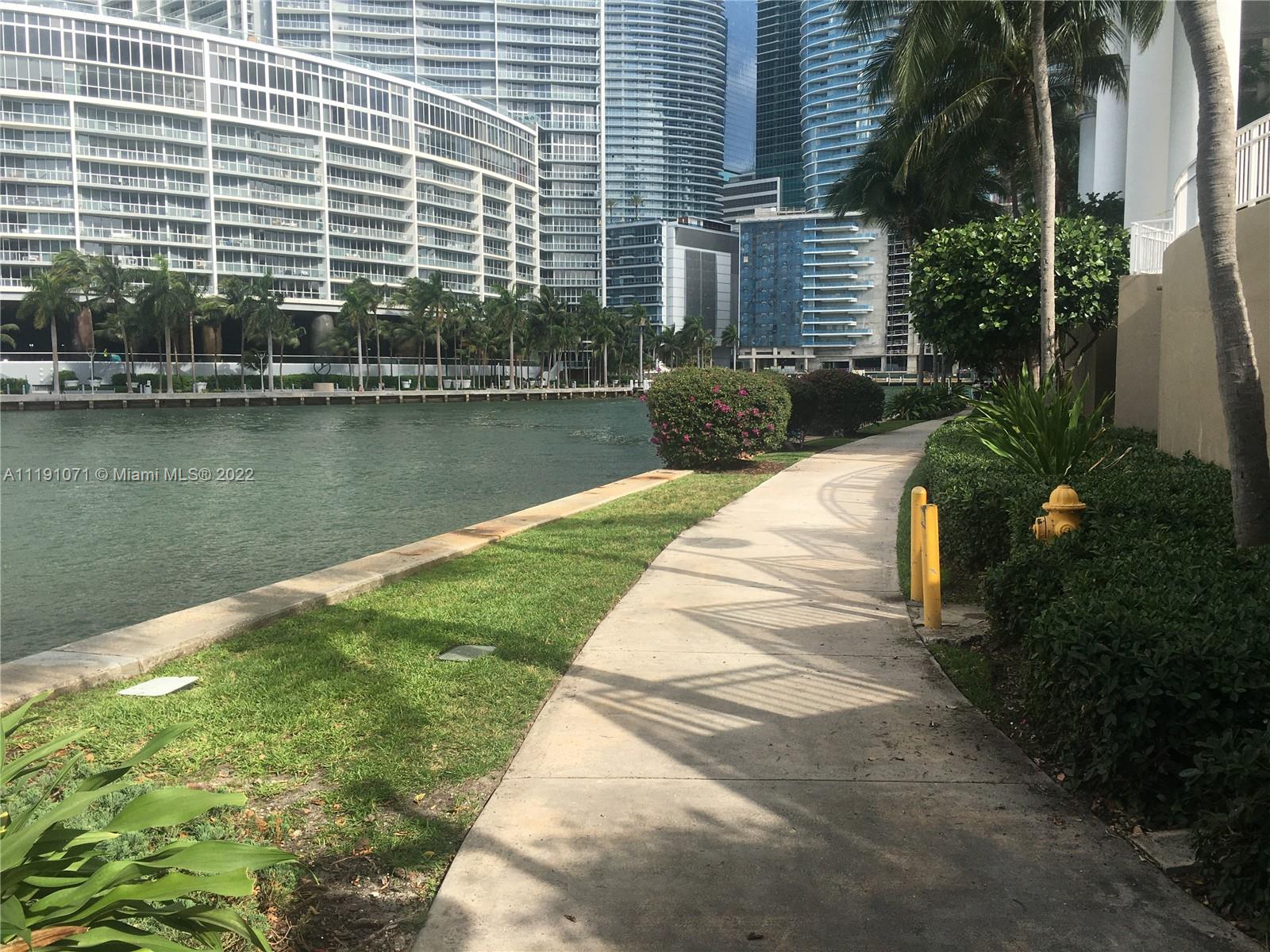 701 Brickell Key Boulevard, Unit 1502 Miami, FL 33131 - Photo 21 of 21 a view of a house with a yard