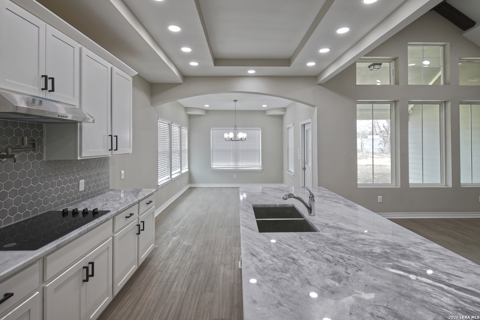 918 Marbach Road Somerset, TX 78069 - Photo 11 of 36 a large white kitchen with lots of counter space and window