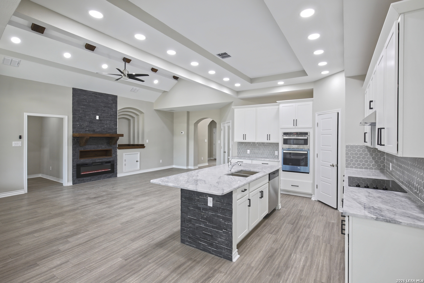 918 Marbach Road Somerset, TX 78069 - Photo 13 of 36 a kitchen with stainless steel appliances granite countertop a stove oven and a refrigerator