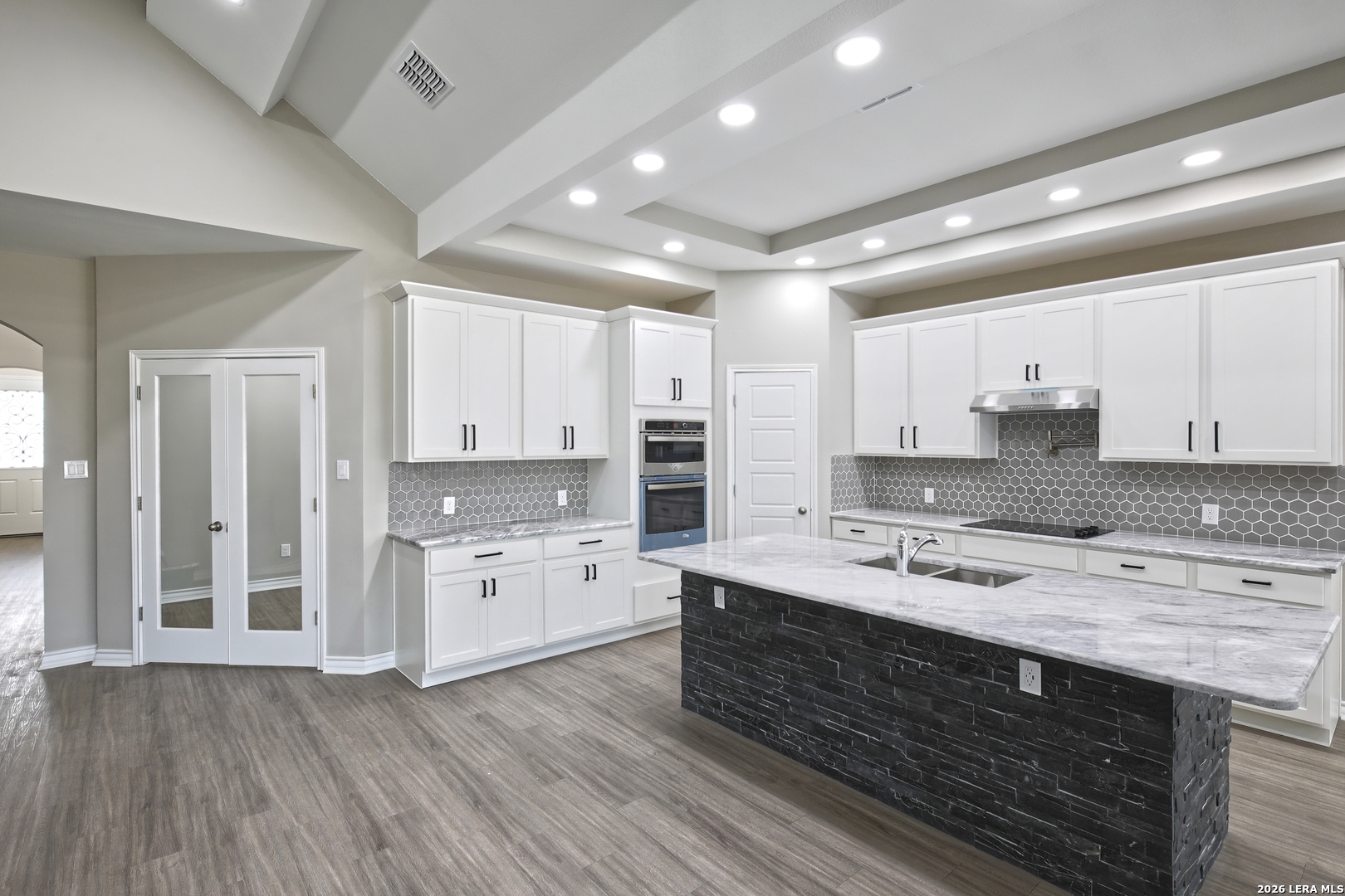 918 Marbach Road Somerset, TX 78069 - Photo 15 of 36 a large kitchen with stainless steel appliances granite countertop a stove oven and a refrigerator