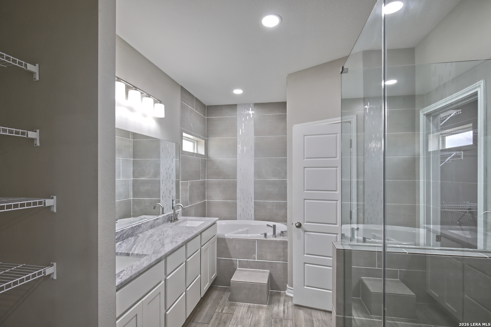 918 Marbach Road Somerset, TX 78069 - Photo 19 of 36 a bathroom with a granite countertop sink mirror and double