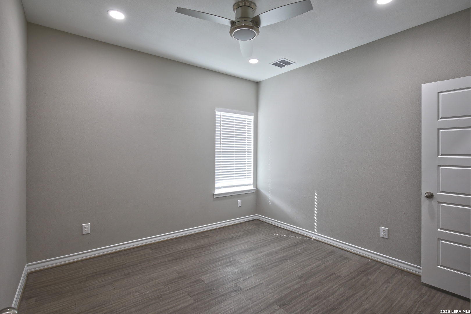 918 Marbach Road Somerset, TX 78069 - Photo 23 of 36 wooden floor in an empty room with a window