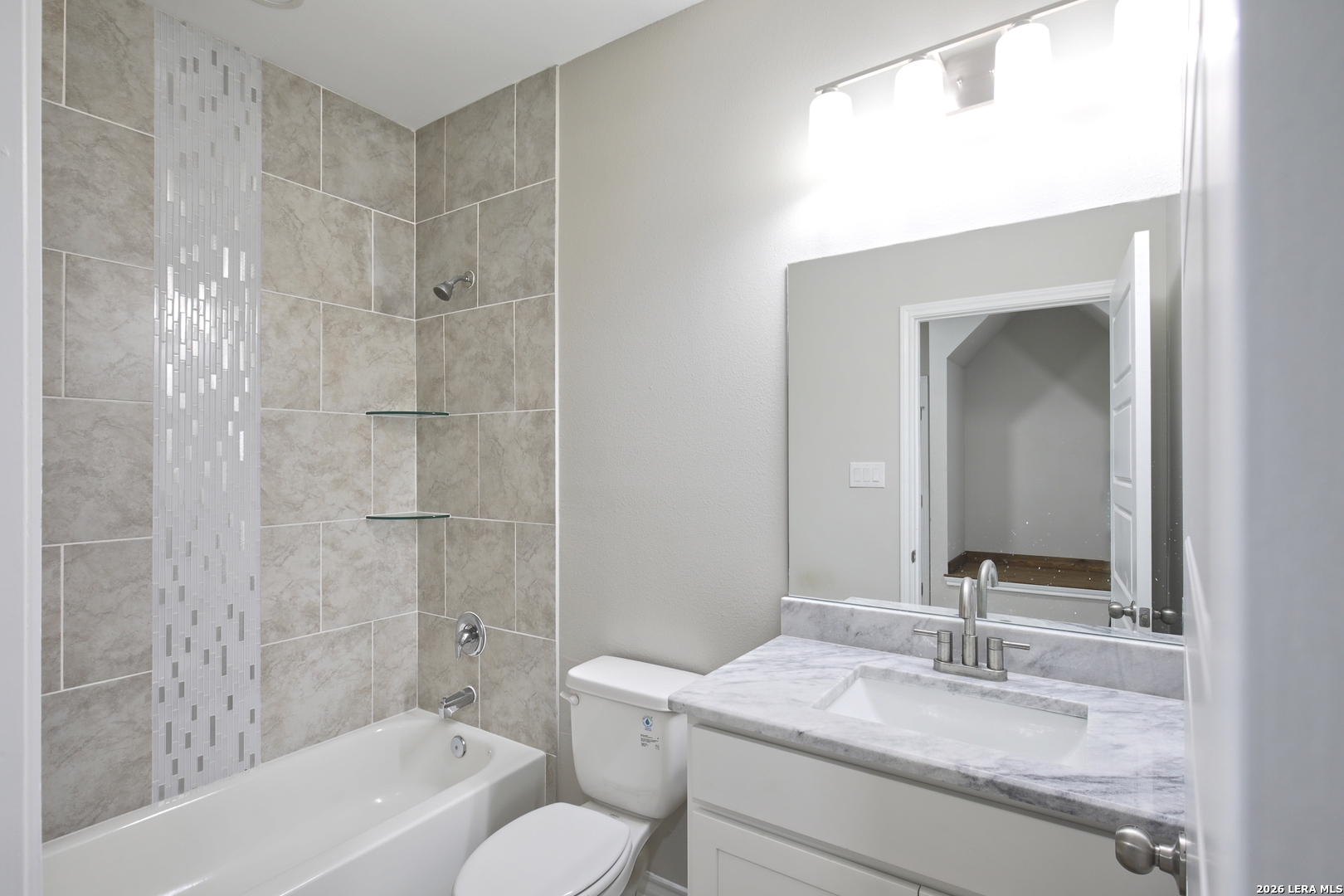 918 Marbach Road Somerset, TX 78069 - Photo 29 of 36 a bathroom with a granite countertop sink toilet and shower