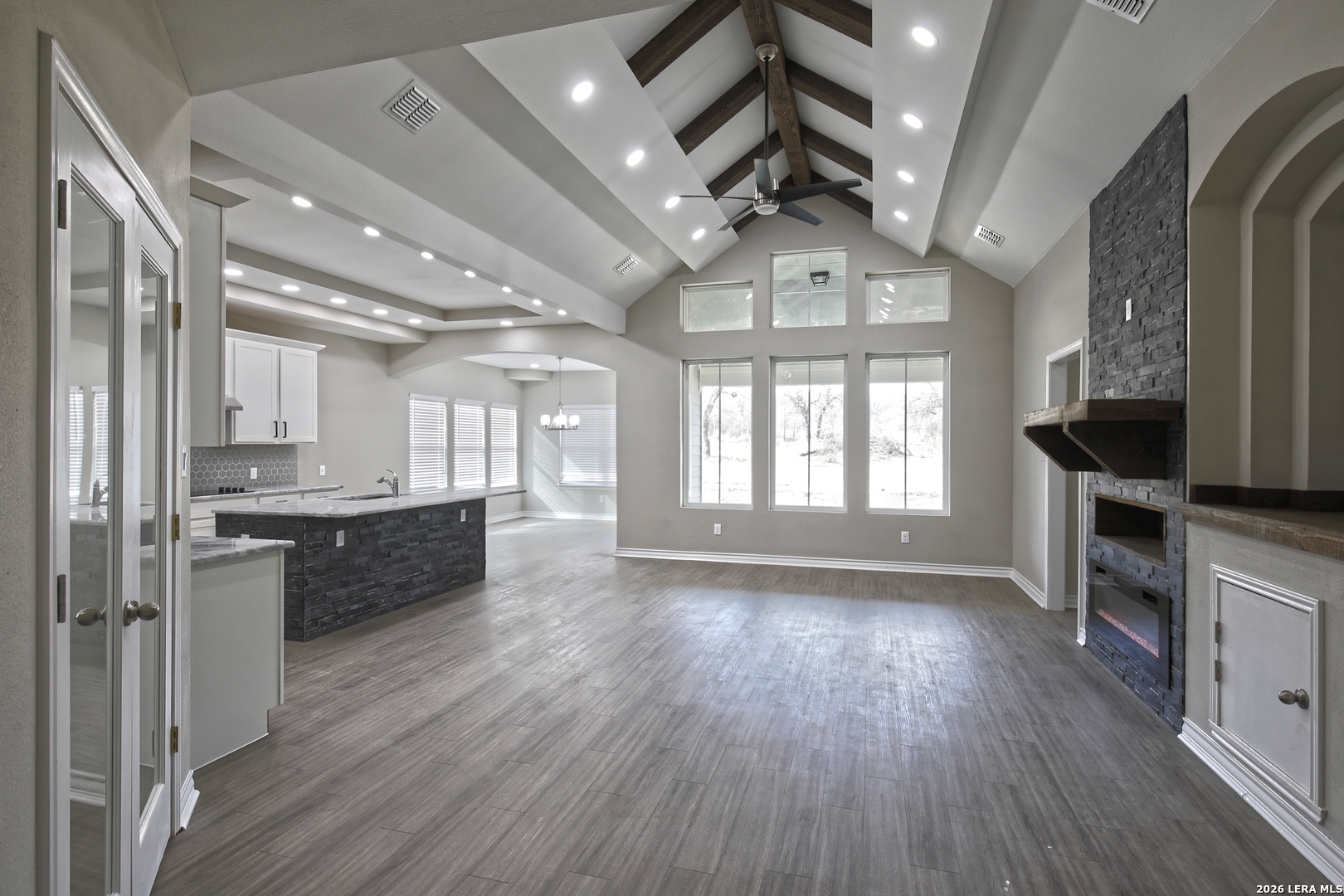 918 Marbach Road Somerset, TX 78069 - Photo 7 of 36 a large kitchen with stainless steel appliances granite countertop a large counter top a stove and a wooden floors