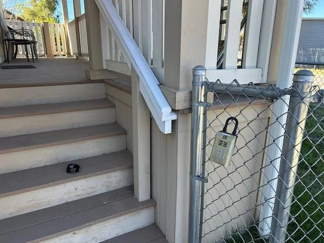 a view of staircase with white walls and a window