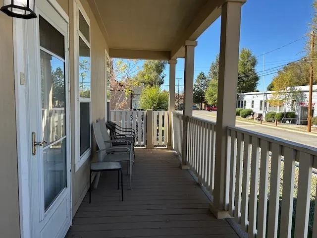 a view of a balcony with chairs