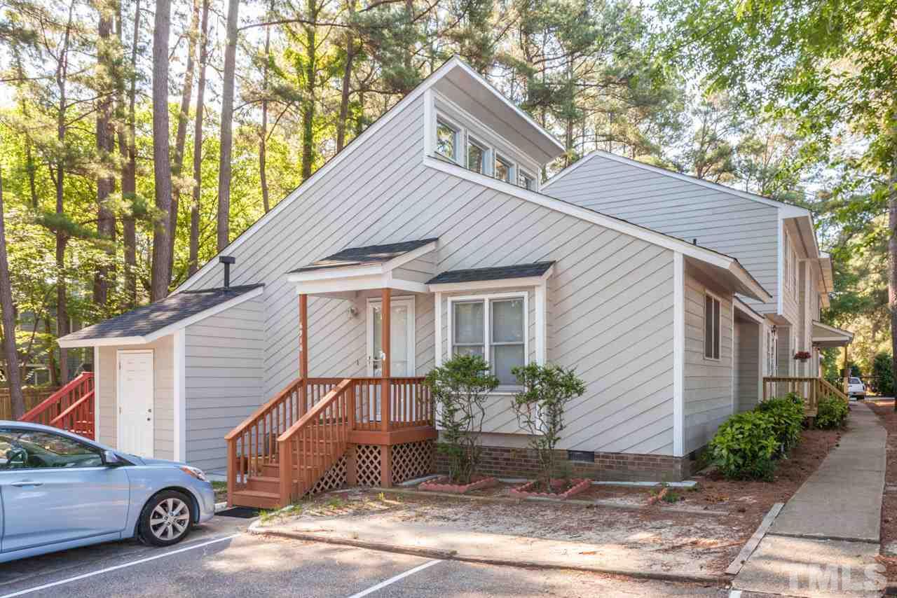 6904 Falls Of Neuse Road, Unit 6904 Raleigh, NC 27615 - Photo 1 of 23 a view of a house with a yard