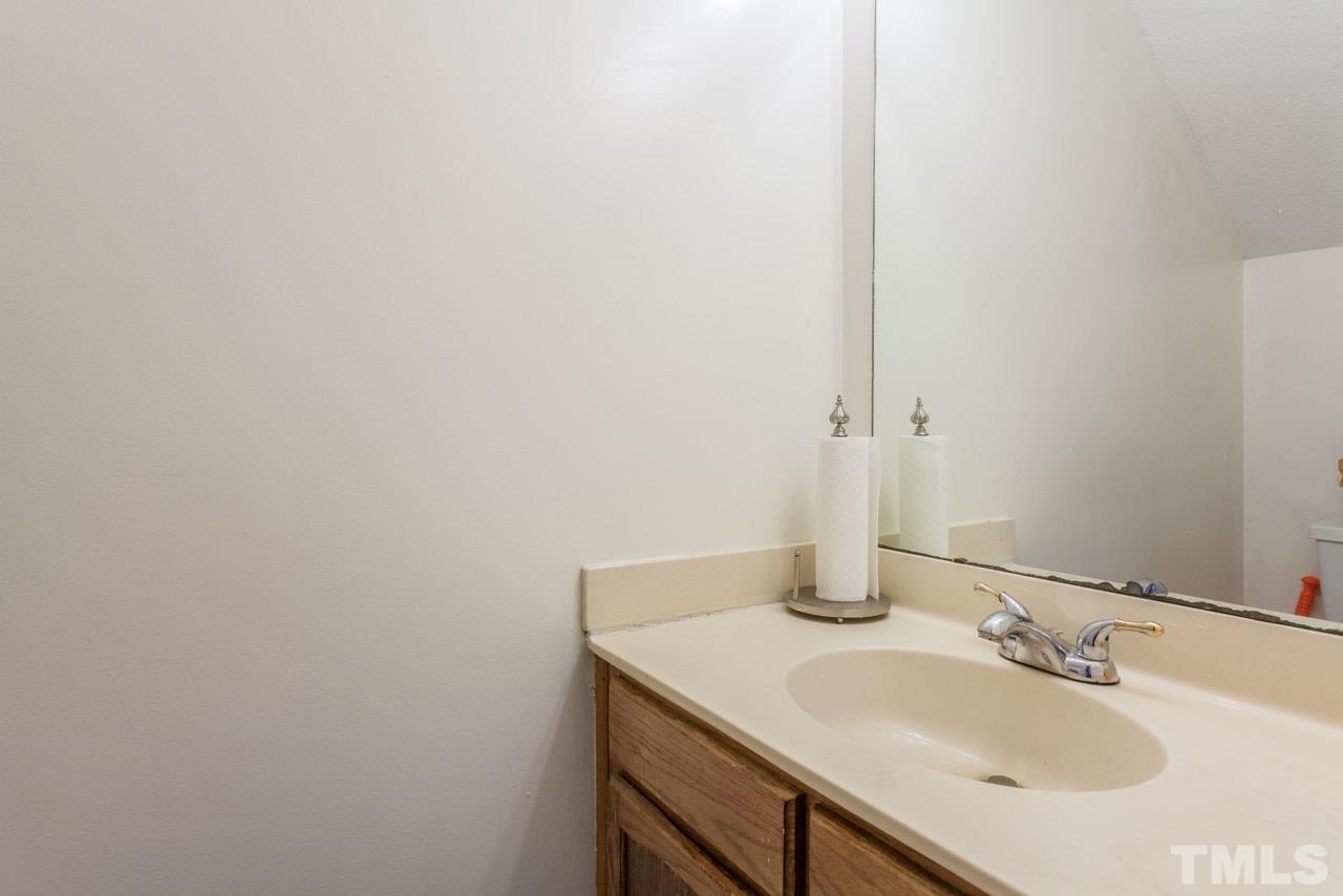 6904 Falls Of Neuse Road, Unit 6904 Raleigh, NC 27615 - Photo 12 of 23 a bathroom with a sink and a mirror