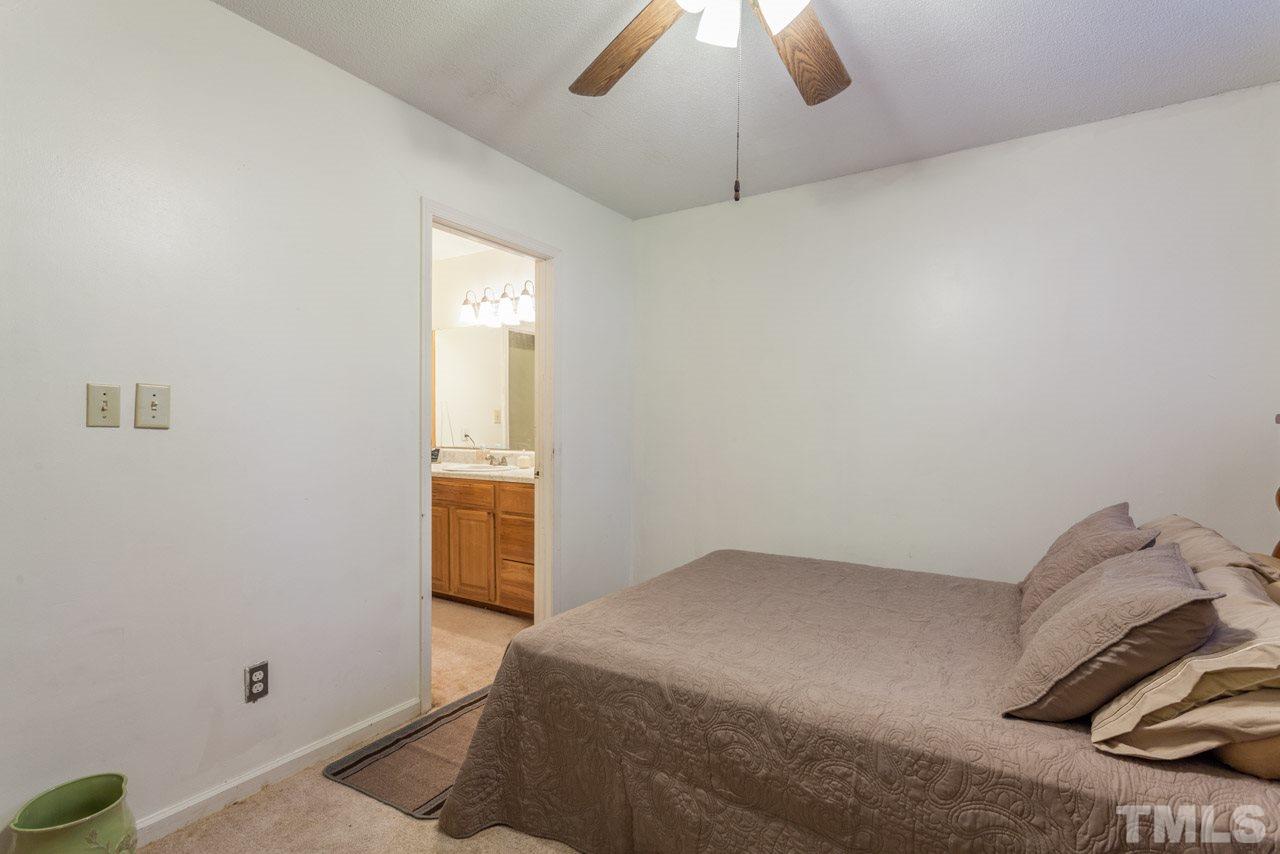 6904 Falls Of Neuse Road, Unit 6904 Raleigh, NC 27615 - Photo 18 of 23 a bedroom with a bed and a window