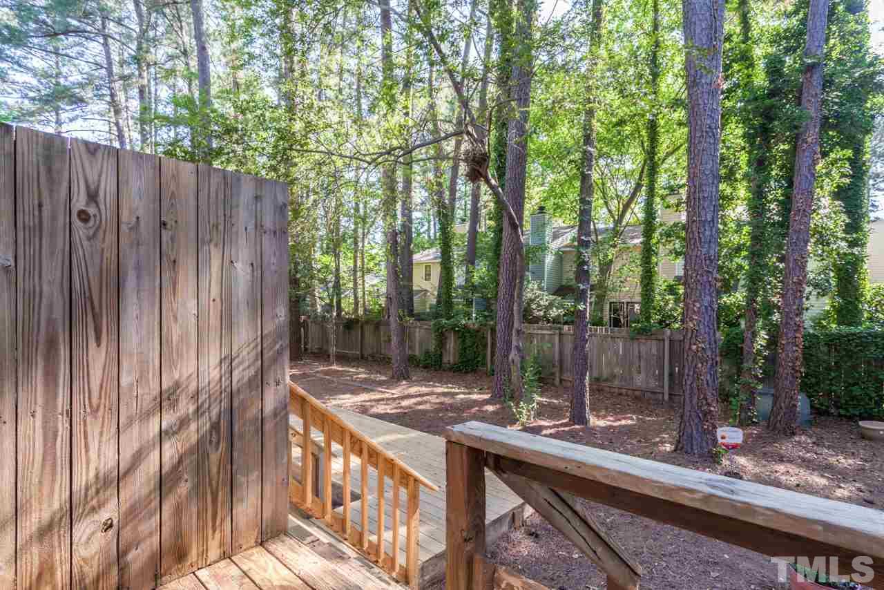 6904 Falls Of Neuse Road, Unit 6904 Raleigh, NC 27615 - Photo 23 of 23 a view of outdoor space with deck and trees
