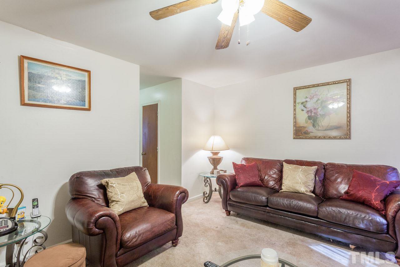 6904 Falls Of Neuse Road, Unit 6904 Raleigh, NC 27615 - Photo 7 of 23 a living room with furniture