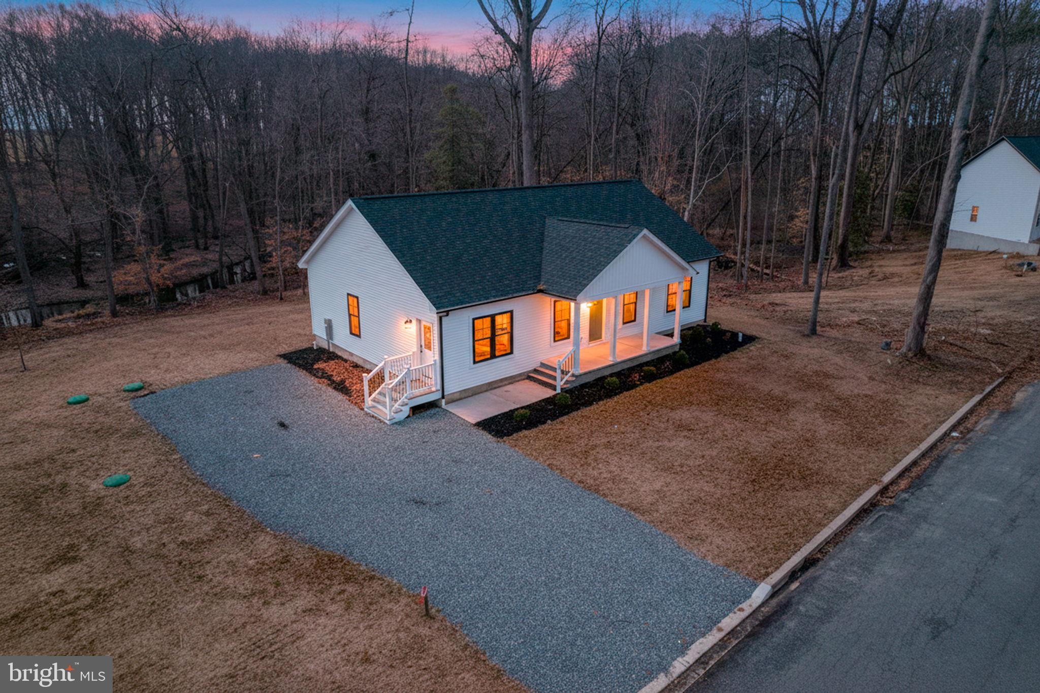 156 Pratts Branch Road Felton, DE 19943 - Photo 1 of 35 a house view with a backyard space