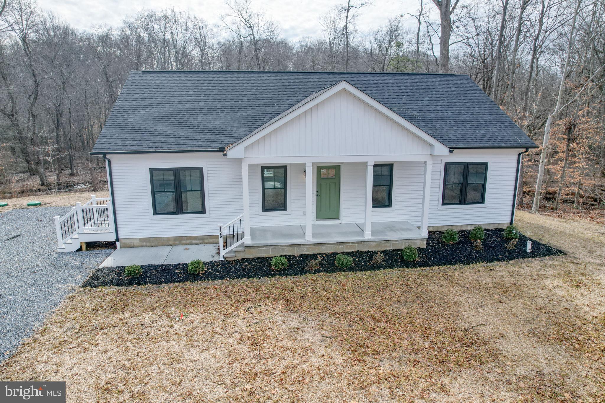 156 Pratts Branch Road Felton, DE 19943 - Photo 2 of 35 a front view of a house with garden