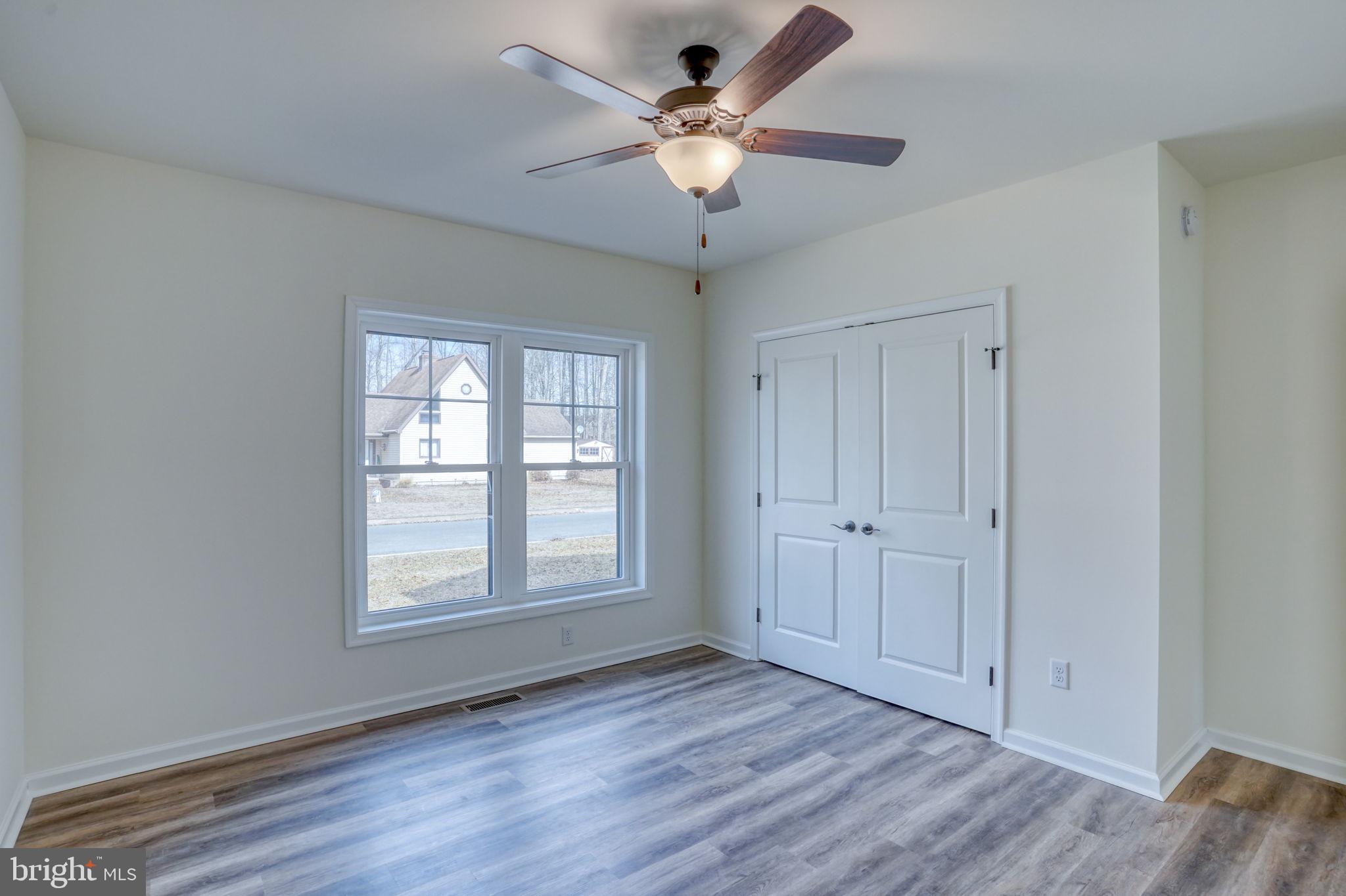 156 Pratts Branch Road Felton, DE 19943 - Photo 25 of 35 wooden floor in an empty room with a window
