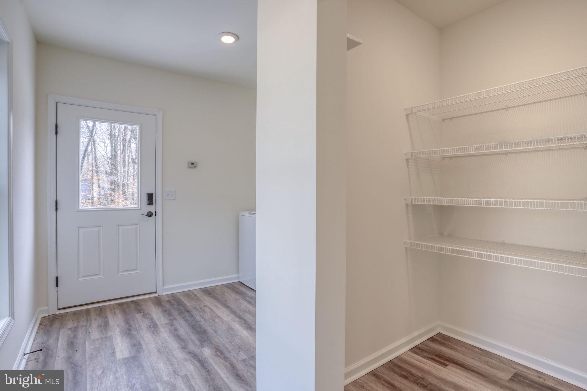156 Pratts Branch Road Felton, DE 19943 - Photo 26 of 35 a view of an empty room with closet and wooden floor