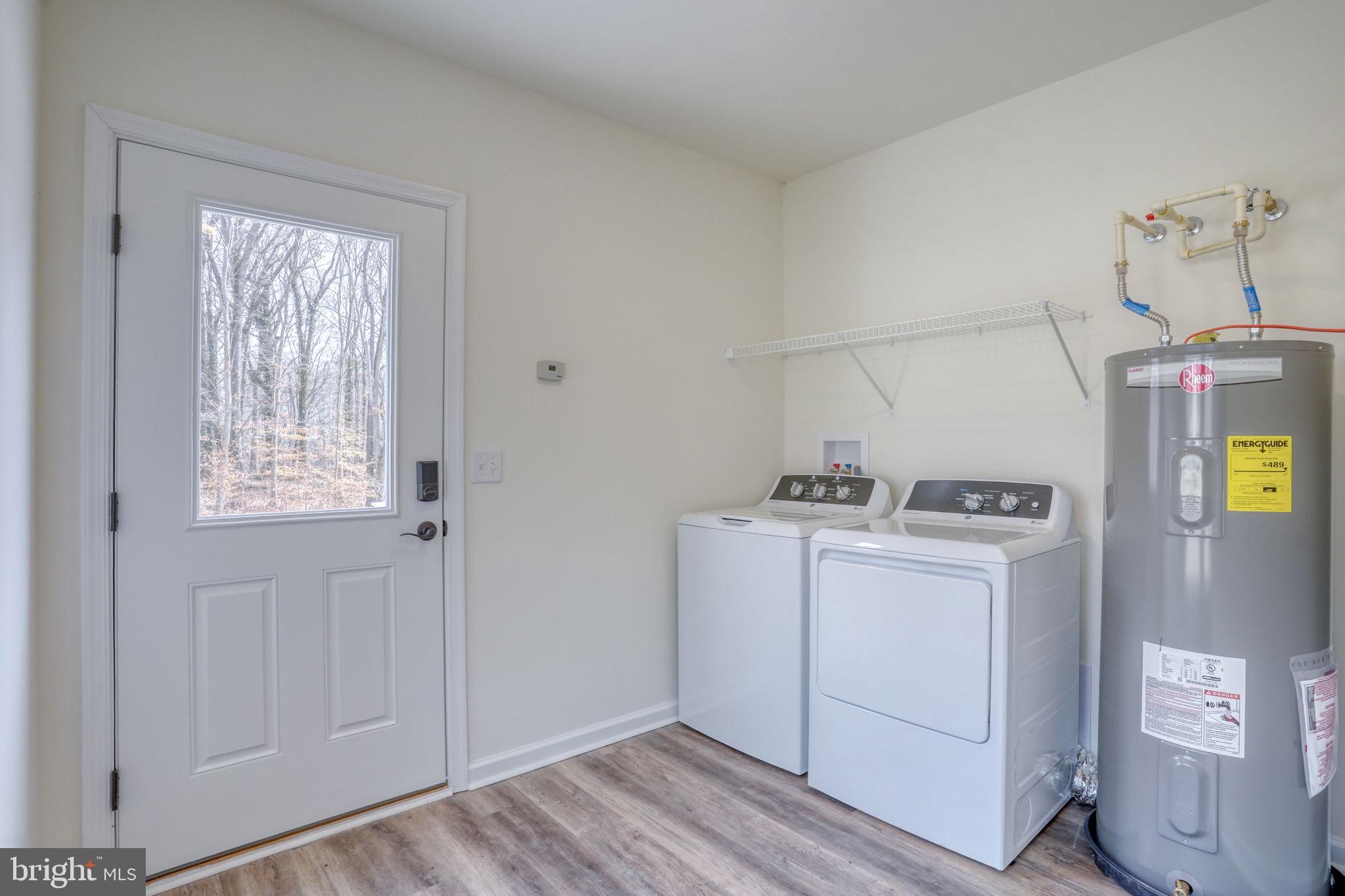156 Pratts Branch Road Felton, DE 19943 - Photo 27 of 35 a utility room with dryer and washer