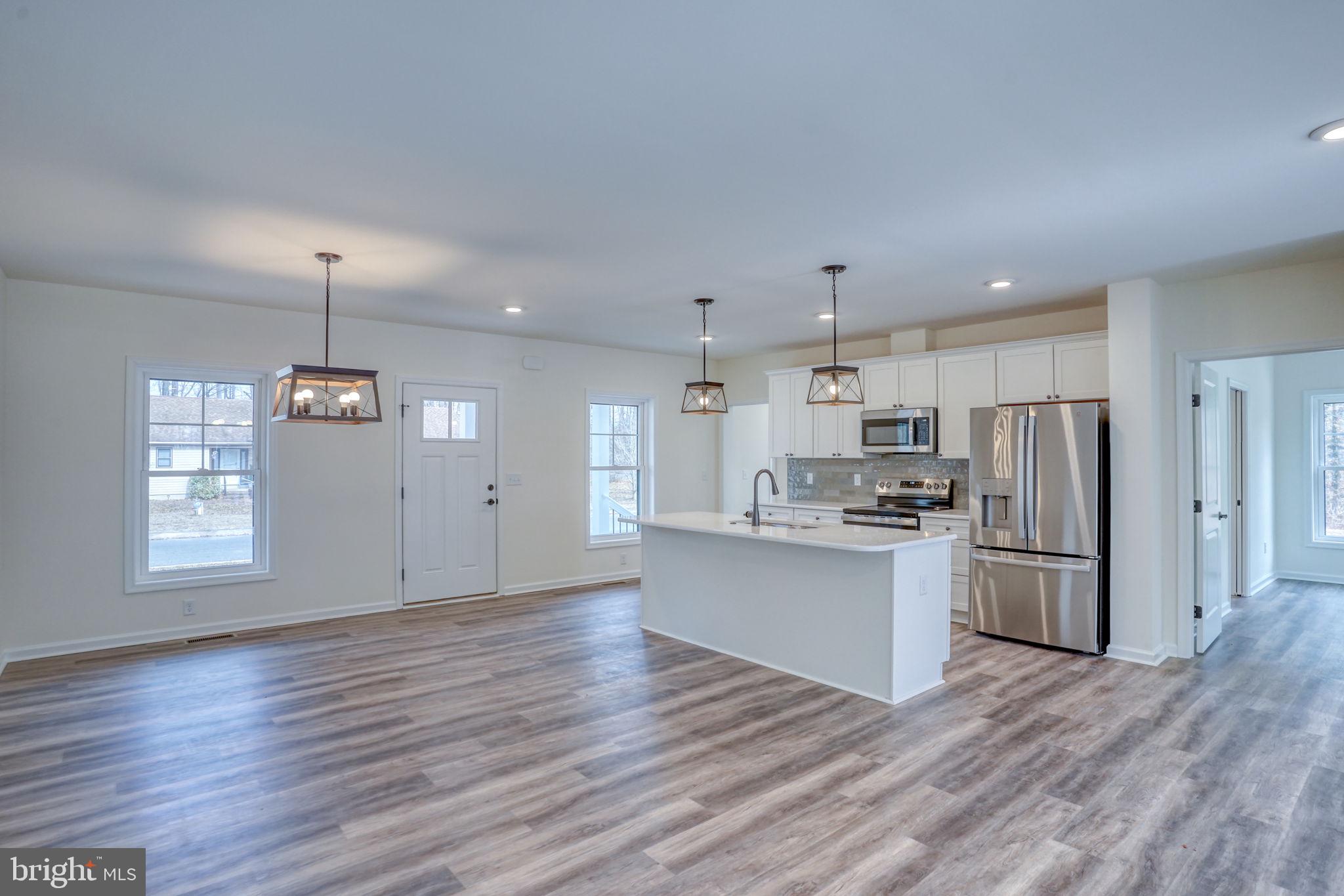 156 Pratts Branch Road Felton, DE 19943 - Photo 7 of 35 a kitchen with refrigerator and window