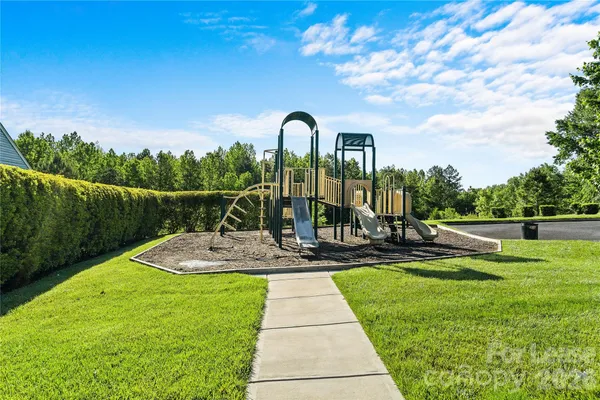 a view of an outdoor space and basketball court