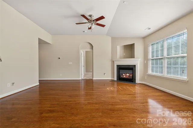 a kitchen with a sink a refrigerator a stove and cabinets