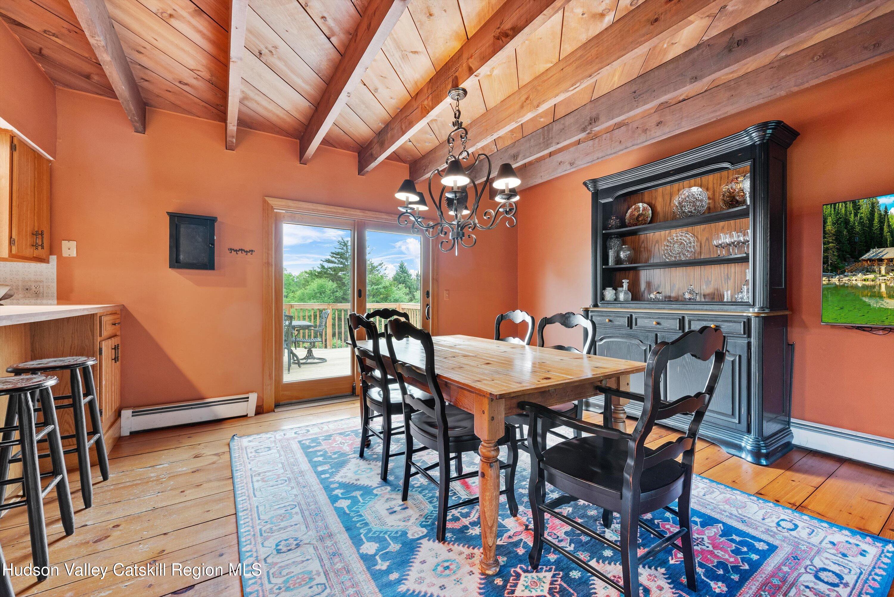 141 East Ridge Road Warwick, NY 10990 - Photo 15 of 57 a view of a dining room with furniture and wooden floor