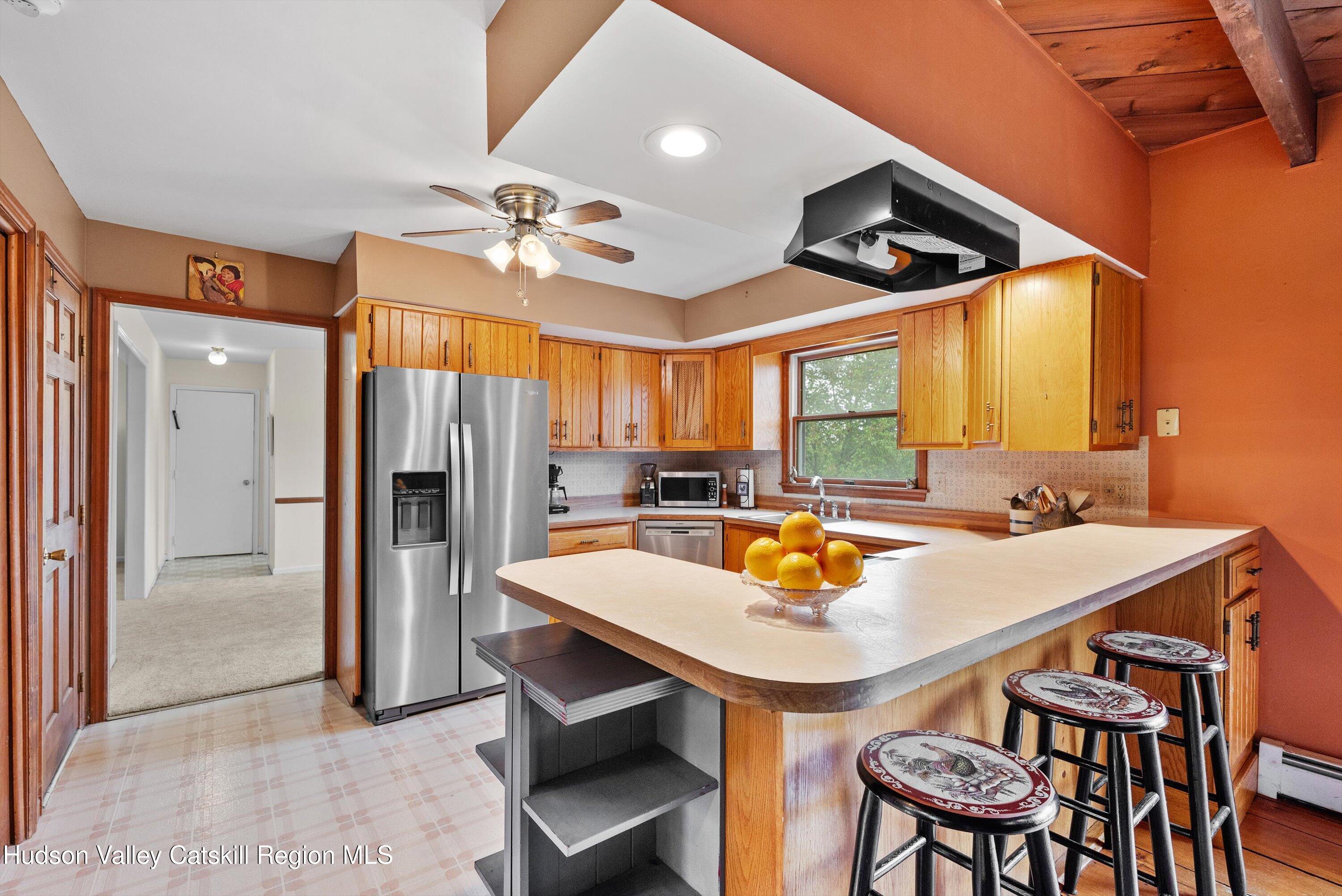 141 East Ridge Road Warwick, NY 10990 - Photo 17 of 57 a view of a dining room with furniture and a chandelier