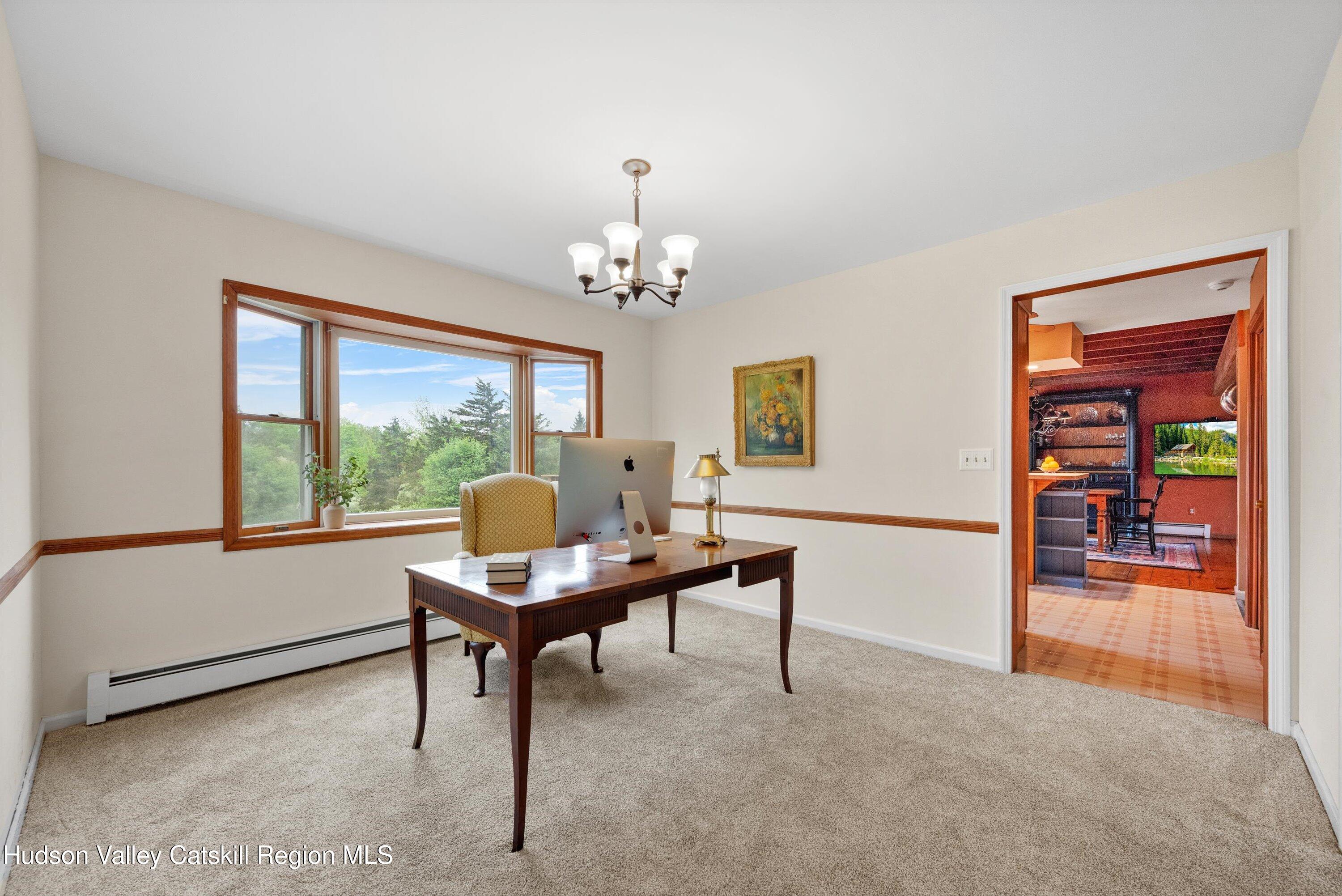 141 East Ridge Road Warwick, NY 10990 - Photo 21 of 57 a view of a workspace with furniture and a window
