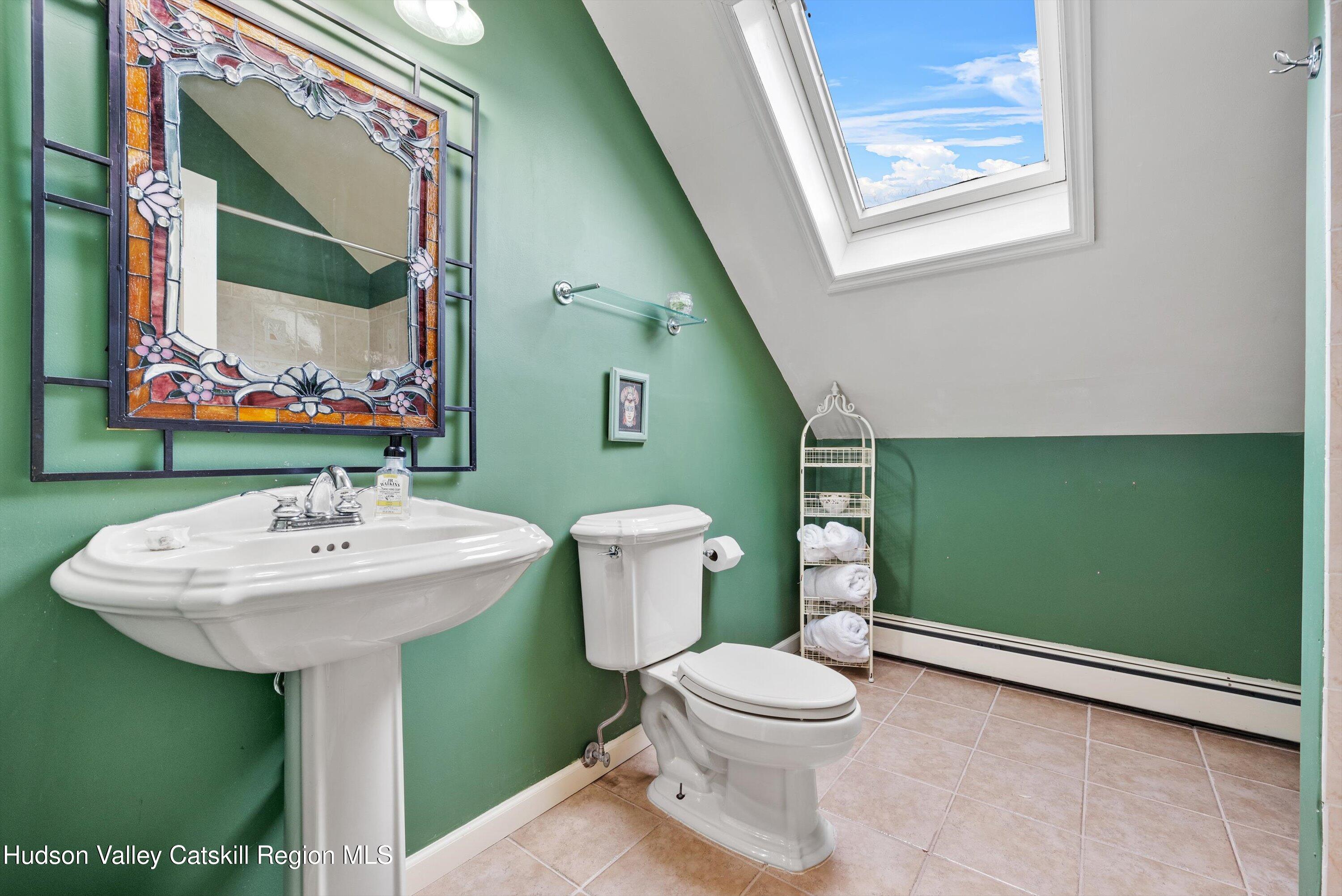 141 East Ridge Road Warwick, NY 10990 - Photo 33 of 57 a bathroom with a toilet sink and mirror