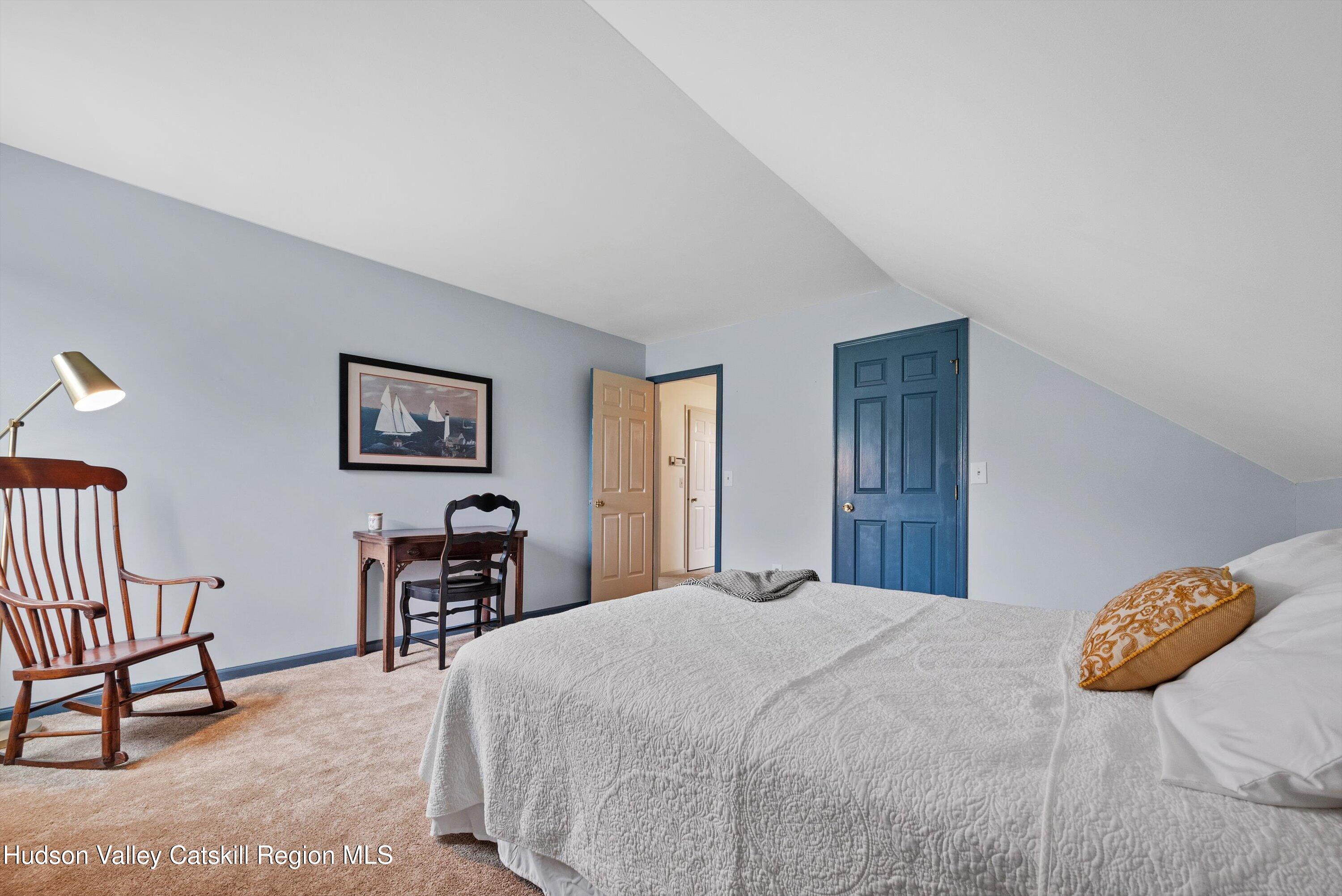 141 East Ridge Road Warwick, NY 10990 - Photo 36 of 57 a bedroom with a bed and dresser with mirror